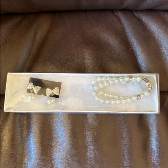 Jewelry - Faux white bow pearl earrings NIP and matching elastic bracelet set. Never worn.